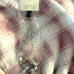 New Ali Khan Necklace. Beautiful iridescent colors. New in package.